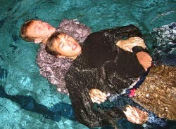 lifesaving swimming in clothes