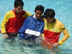 RESCUE, INITIATIVE TEST, 3
Rescuers assist an injured swimmer onto the beach 4